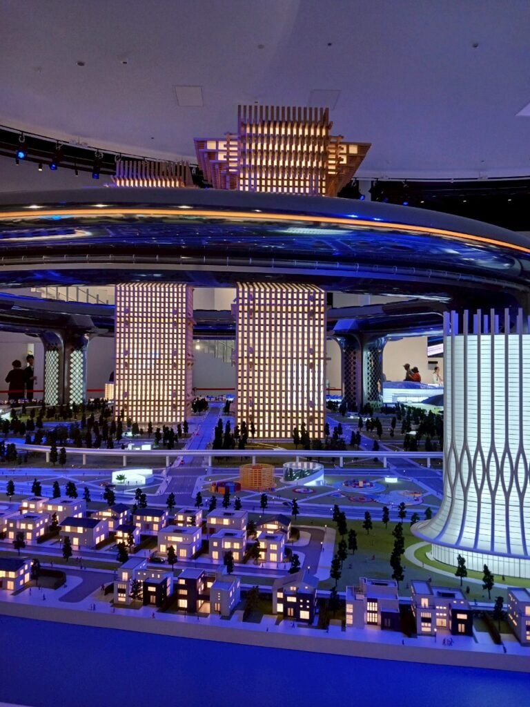 Picture of a pavilion, A futuristic city model with illuminated buildings and modern infrastructure