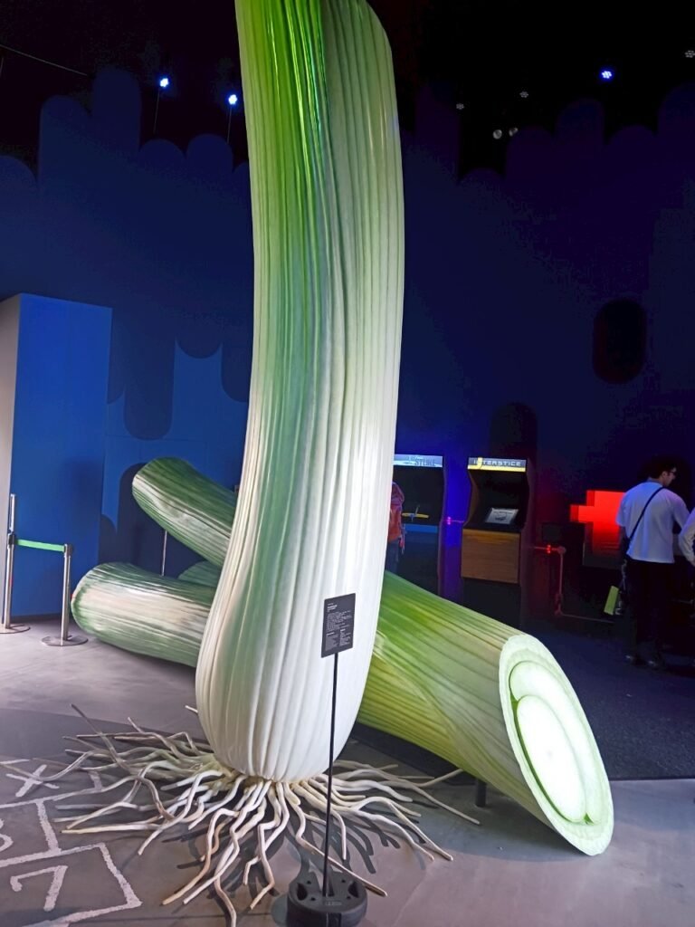 A giant green onion sculpture at Expo 2025.