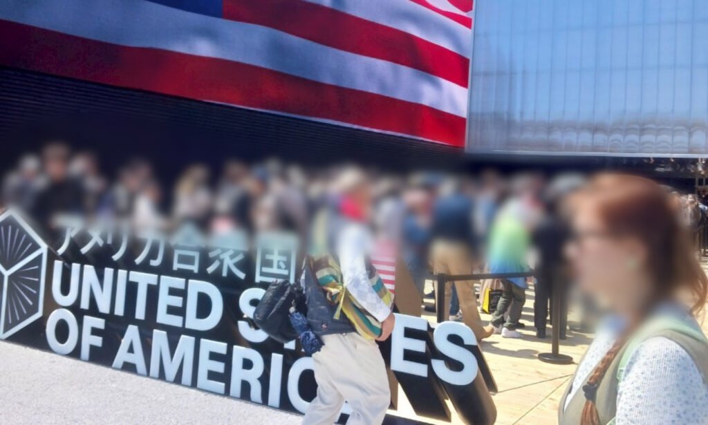 Visitors lining up in front of the United States Pavilion at Expo 2025 Osaka, under a large American flag.